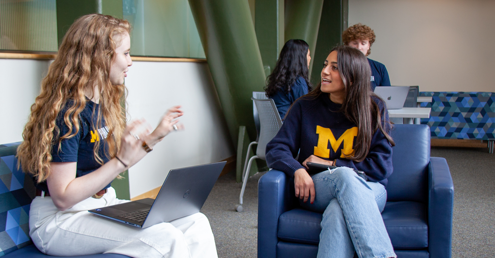 Two University of Michigan students in blue 