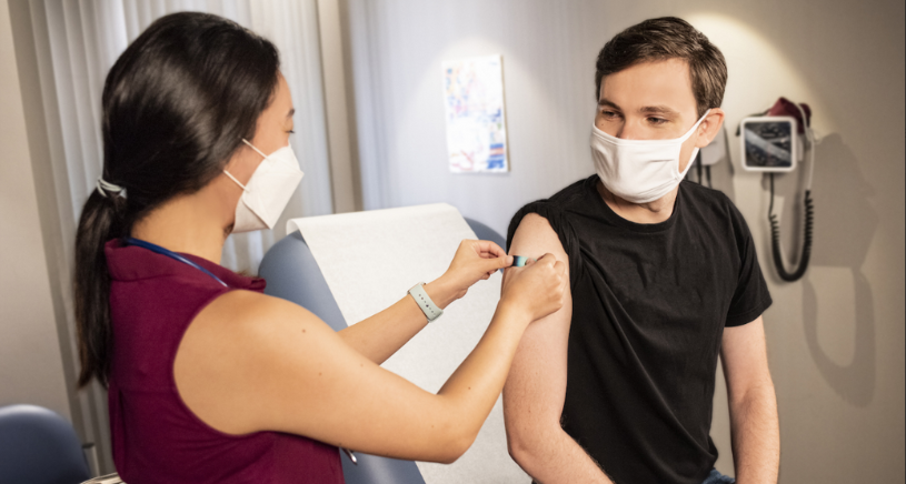 Person receiving a vaccine