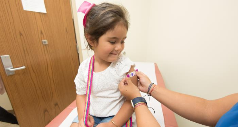 child receiving vaccine