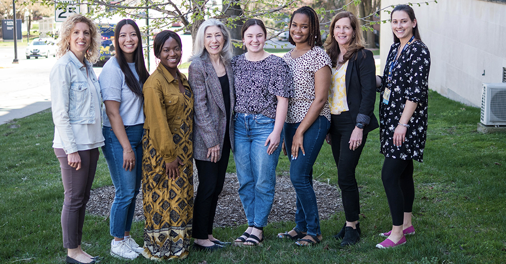 Louise Merriman visits with students from the Nutritional Sciences program at the School of Public Health.