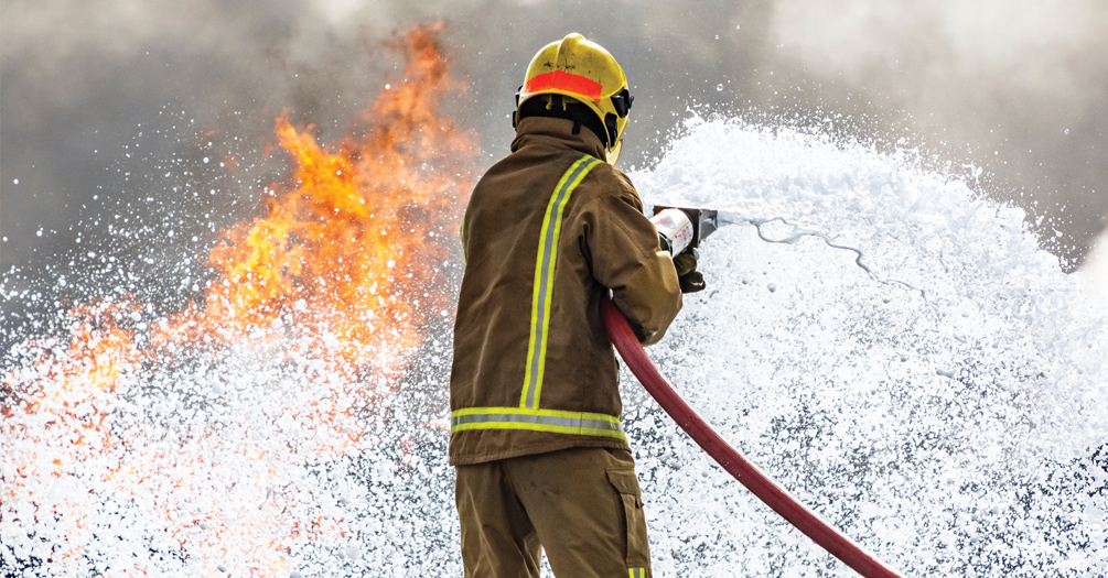 image of fire fighter spraying out fire