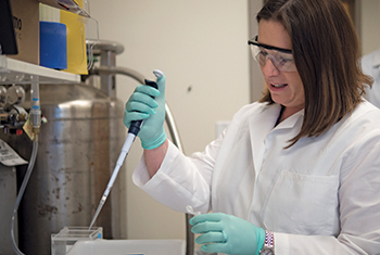 Dana Dolinoy at work in her epigenetics lab, where she studies the now-famous agouti mice.