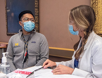 University of Michigan health care professional receives a COVID-19 vaccine on the Ann Arbor campus