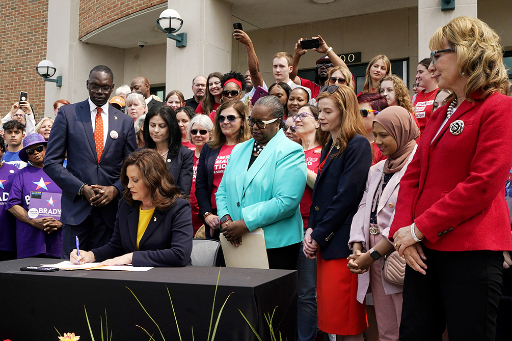 Gov. Whitmer signing legislation on May 22, 2023.