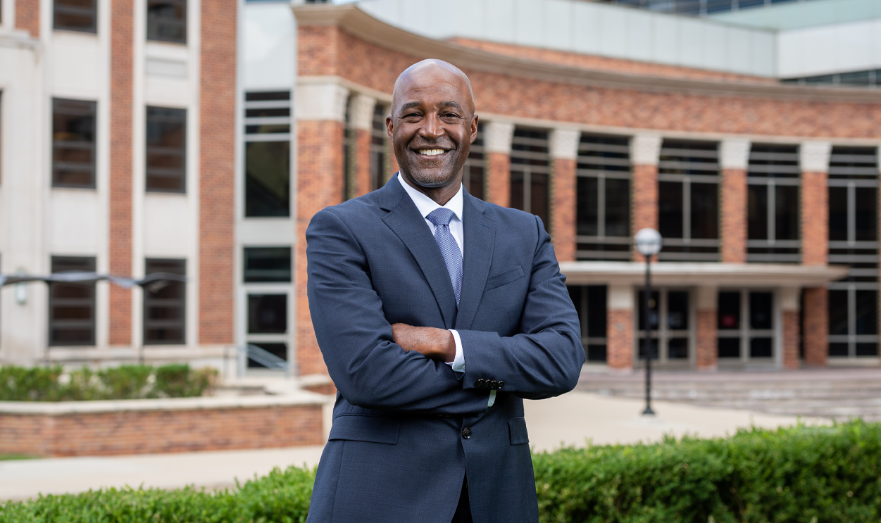 Dean Bowman standing in front of the School of Public Health