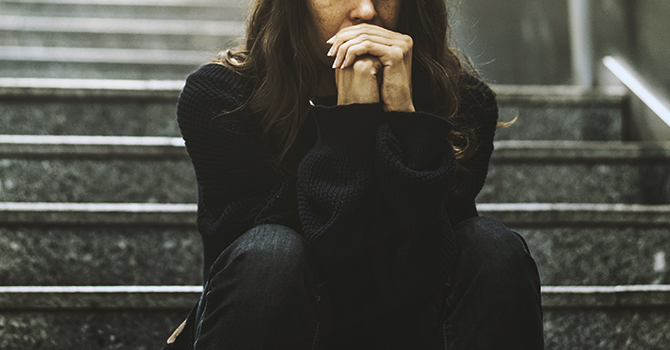 woman sitting on stairs alone