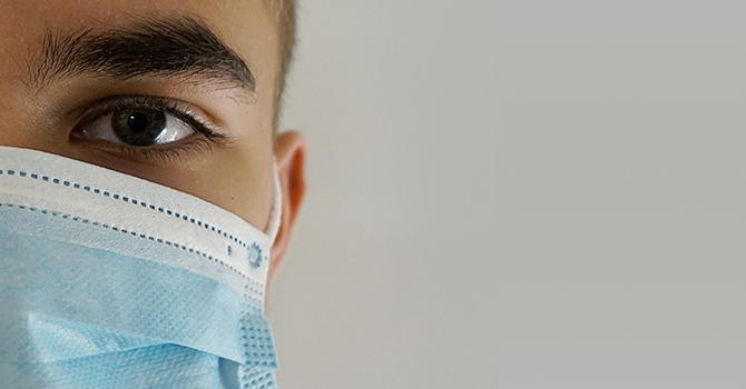 close up of a person wearing a mask