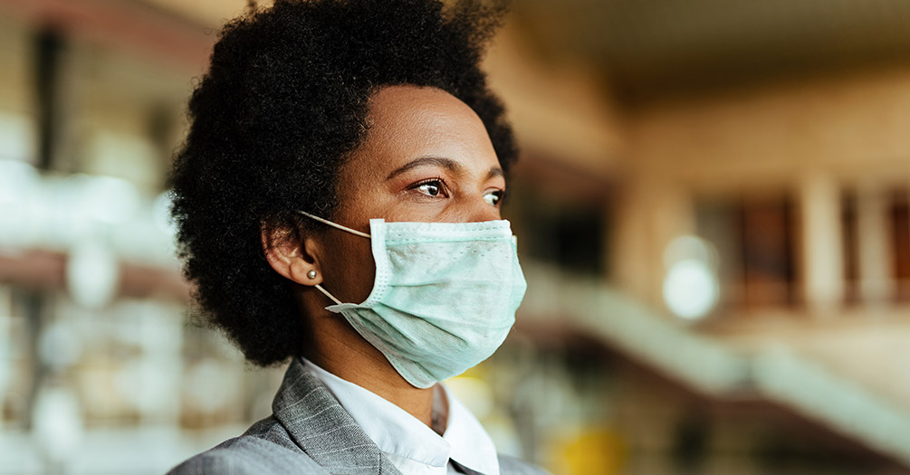 African American woman wearing a mask.