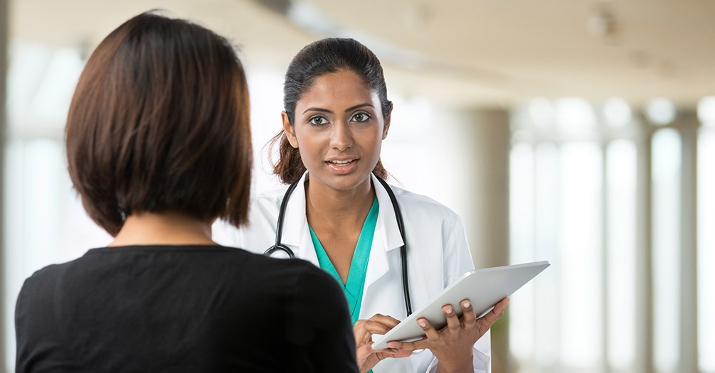 A doctor talking to a patient.