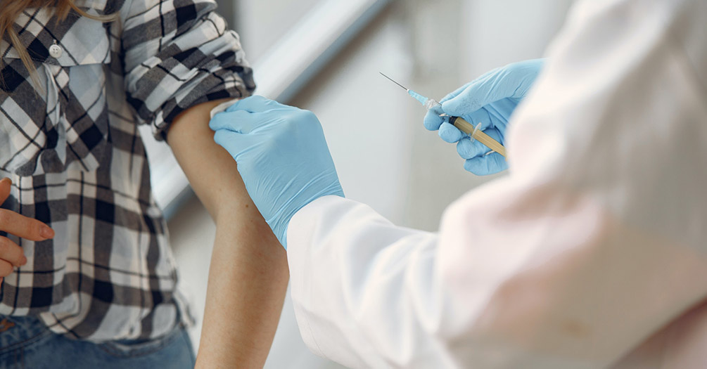 A person receives a flu shot.