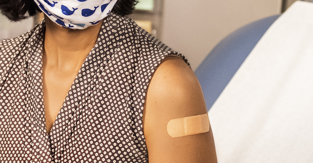 person wearing a mask after being vaccinated