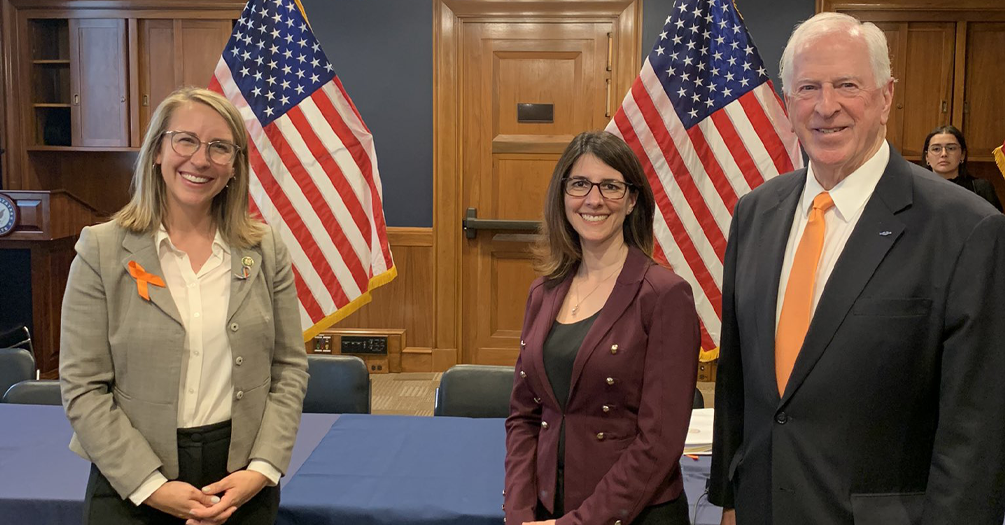 April Zeoli poses for a photo with Reps. Hillary Scholten and Mike Thompson. Congressman Thompson serves as Task Force Chair.