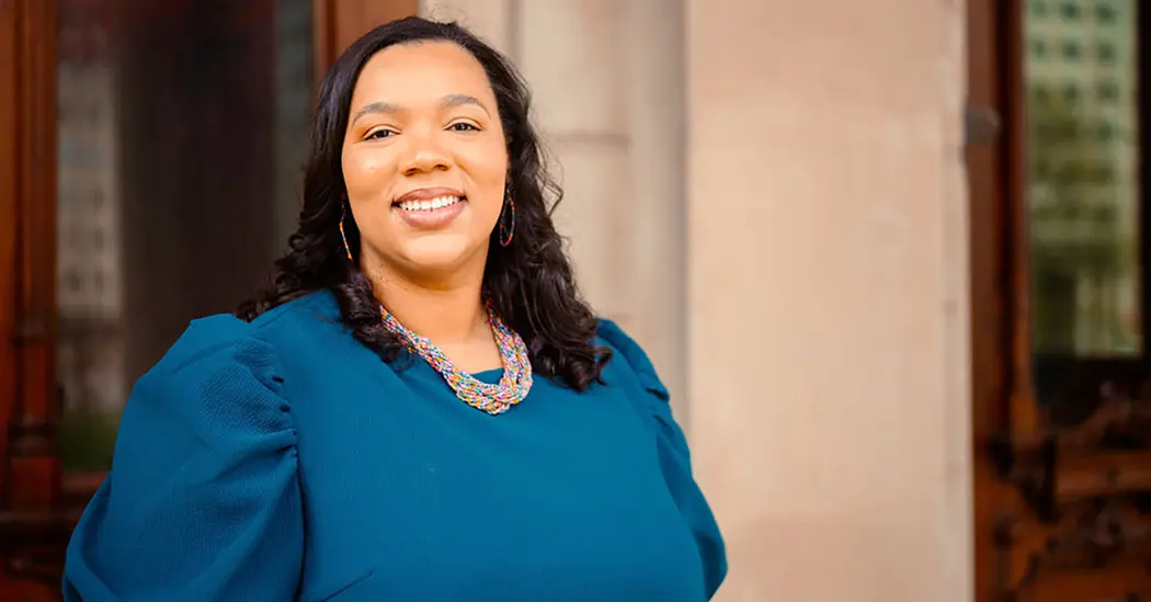 Darla Bishop smiling with a blue top in an office setting