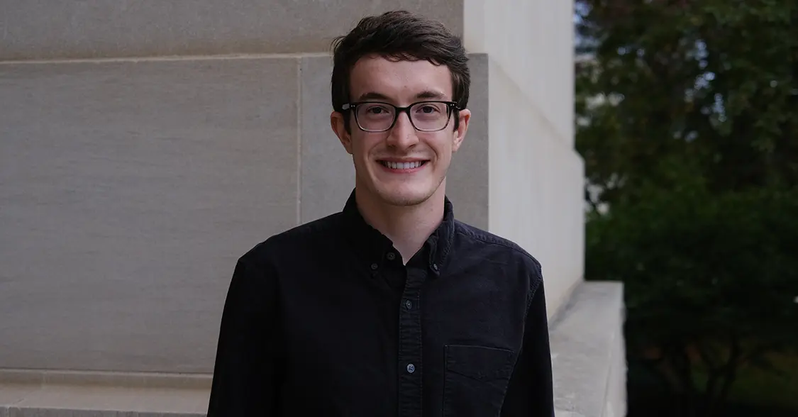 Jason Seekamp with glasses and a dark buttoned shirt